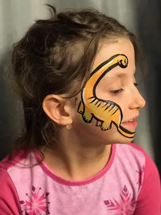 Child with dinosaur facepaint