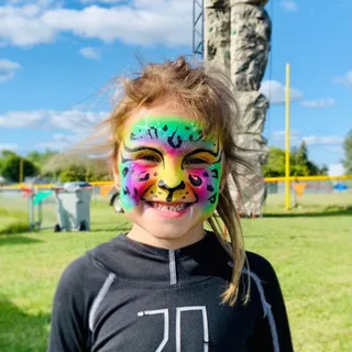 Child with leopard facepaint